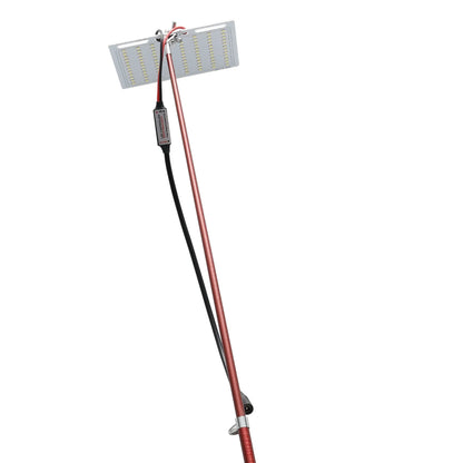 White LED fishing light on a tall telescopic pole, with a 12V battery clip cable and remote controller on grass.