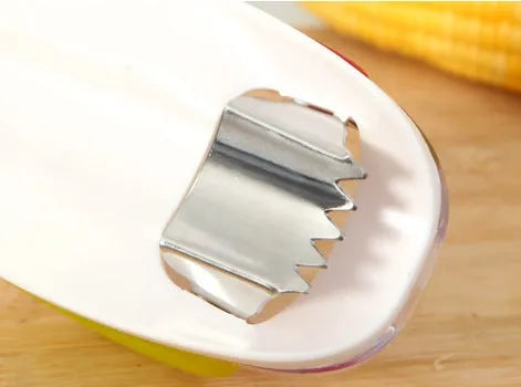 Kitchen corn separator tool with stainless steel blade and plastic case for removing kernels from corncobs