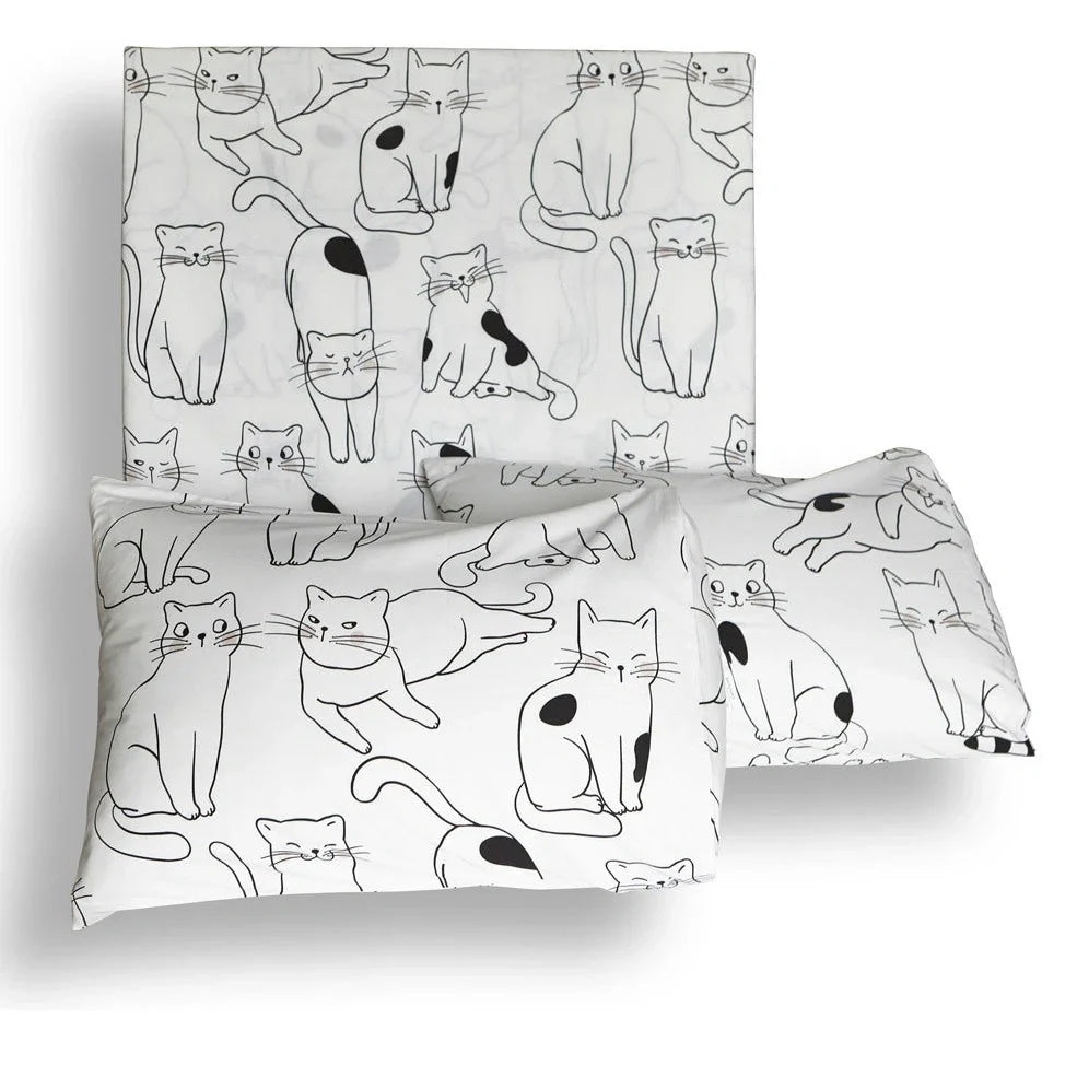 White cotton bedding set with active printed pattern, showing duvet cover, fitted sheet and pillowcases