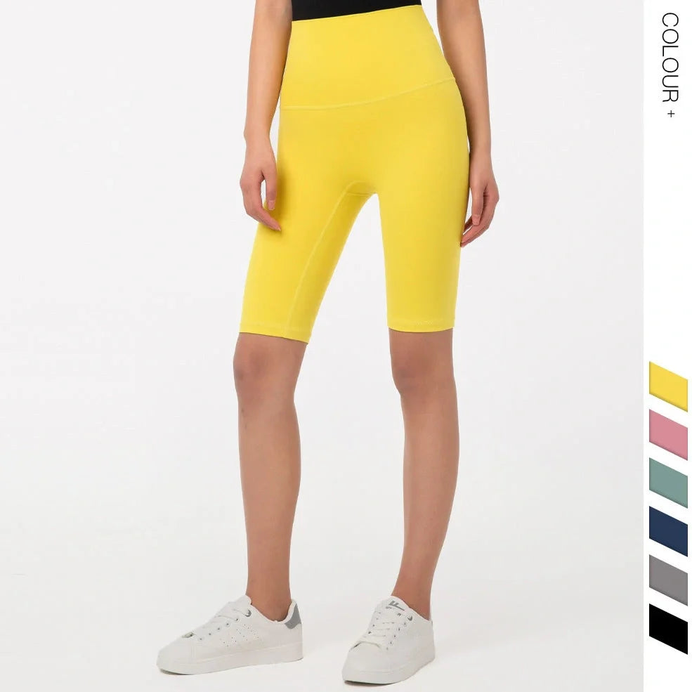 Women's yoga pants with five-point design in tidewater teal colour showing moisture-wicking nylon fabric