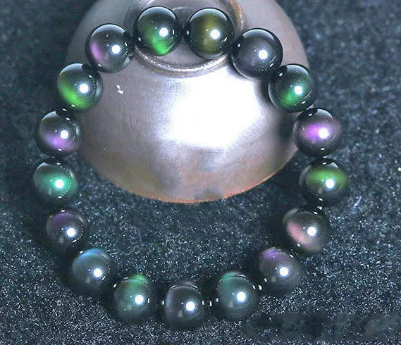 Rainbow Purple Green Eye Obsidian Bracelet with unique color blend and smooth stones