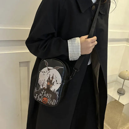 Halloween graffiti print crossbody bag in black with pumpkin, ghost, and bat designs, measuring 14x23x9.5cm