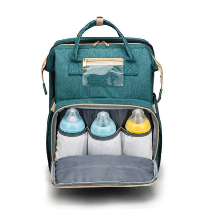 Versatile baby changing backpack with USB charging port and folding portable bed