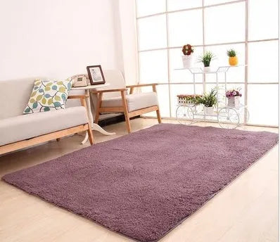 Solid colour plush area rug showing velvet pile texture and rectangular shape