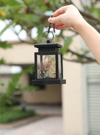 Black solar wind lamp, ABS plastic, 90mm diameter, 128mm height, warm white LED, IPX4 waterproof, for outdoor courtyard use.