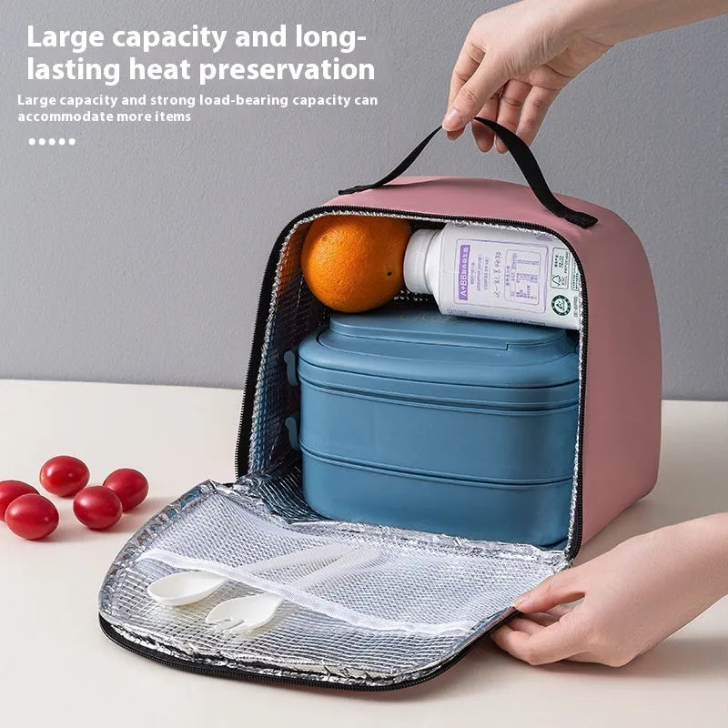 Insulated lunch box bag in sapphire blue textured cloth, shown with a lunch box inside.