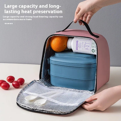 Insulated lunch box bag in sapphire blue textured cloth, shown with a lunch box inside.