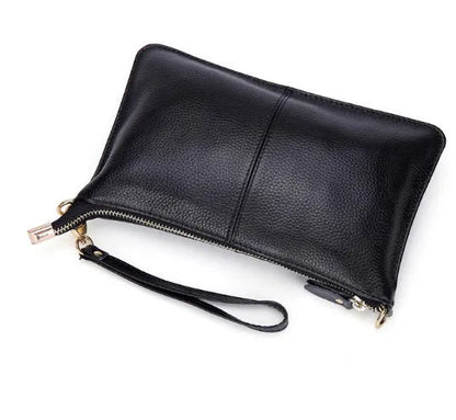 Lady's cowhide slant bag in apricot colour showing front view with strap and compact 24 cm size.