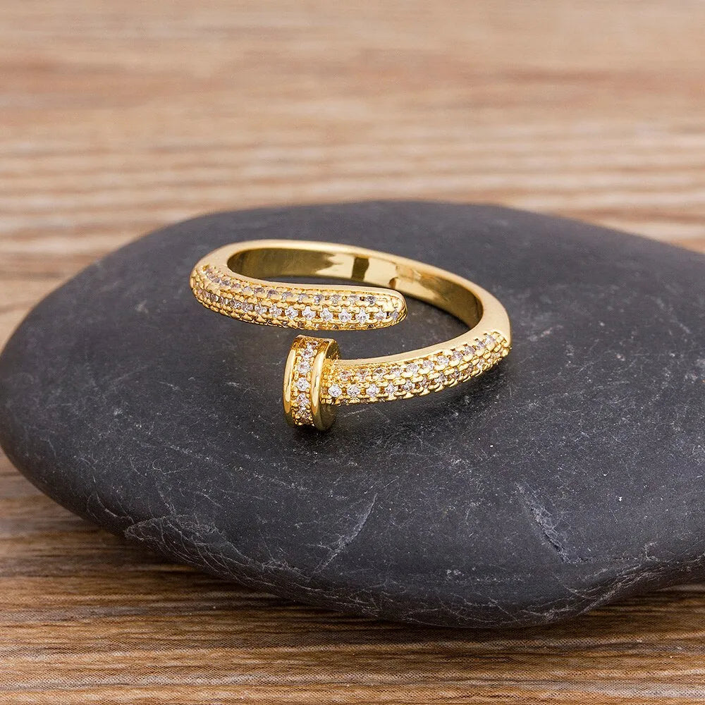 Personalized nail ring in gold with geometric metal design and inlaid drill detail, adjustable opening