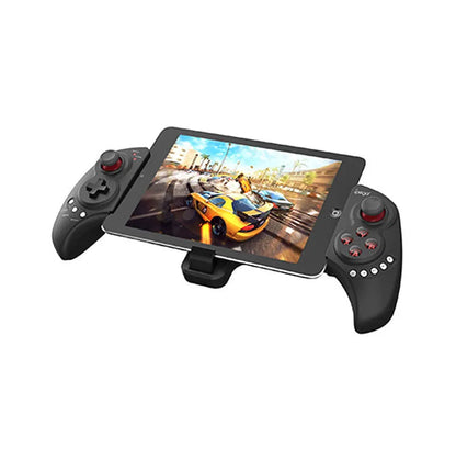 Wireless telescopic game controller extended with a phone inserted, showing buttons and USB port.