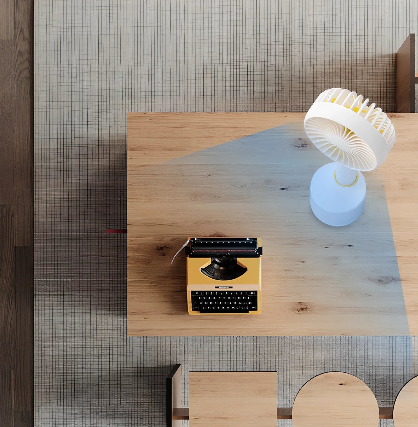 Blue shaking head handheld fan showing oscillating mechanism and USB charging port