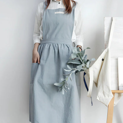 Sleeveless cotton kitchen apron in blue colour showing front coverage and adjustable neck strap