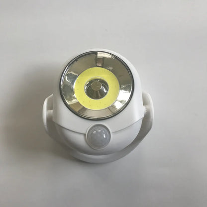 White Atomic Angel touch-control induction night light showing compact design