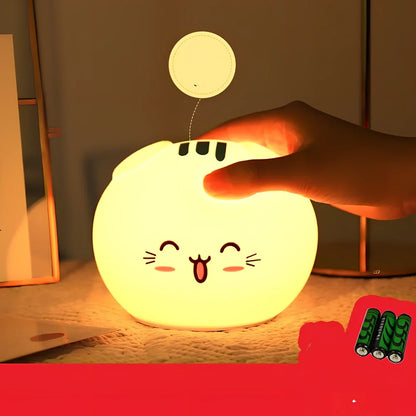 Silicone night light with fold-eared cat design showing LED illumination and USB charging port