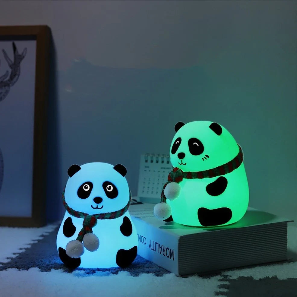 Panda-shaped silicone night light with soft white illumination, USB charging port visible