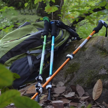 Adjustable aluminum alloy trekking pole in blue, green, or gold for hiking support