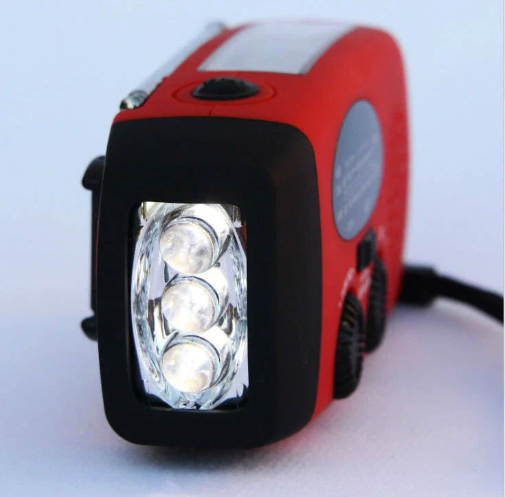 Powerful solar-powered radio and flashlight with hand crank and USB charging capabilities