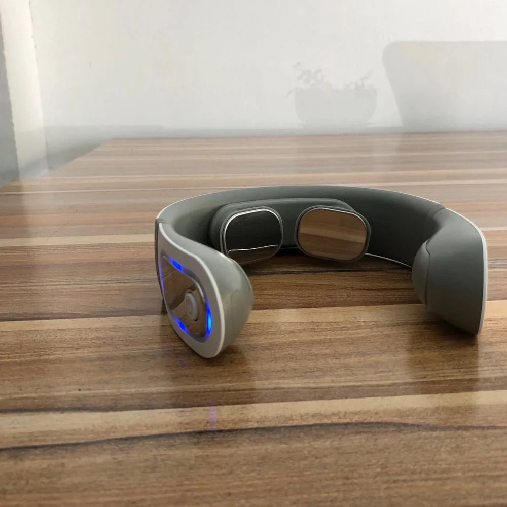 White shoulder neck massager with four rotating heads for mechanical kneading action