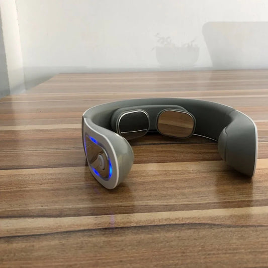 White shoulder neck massager with four rotating heads for mechanical kneading action