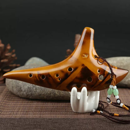Ceramic 12-hole smoldering ocarina in alto C pitch with nest-inspired design