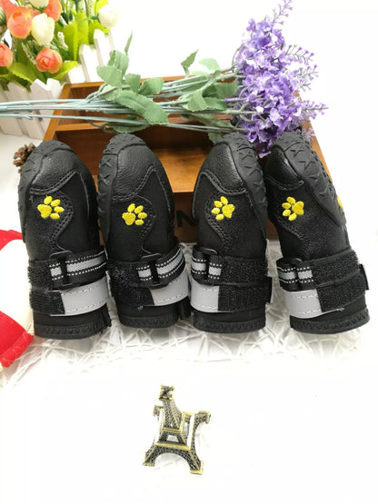 Black waterproof dog shoes with non-slip soles and adjustable fuzzy belts