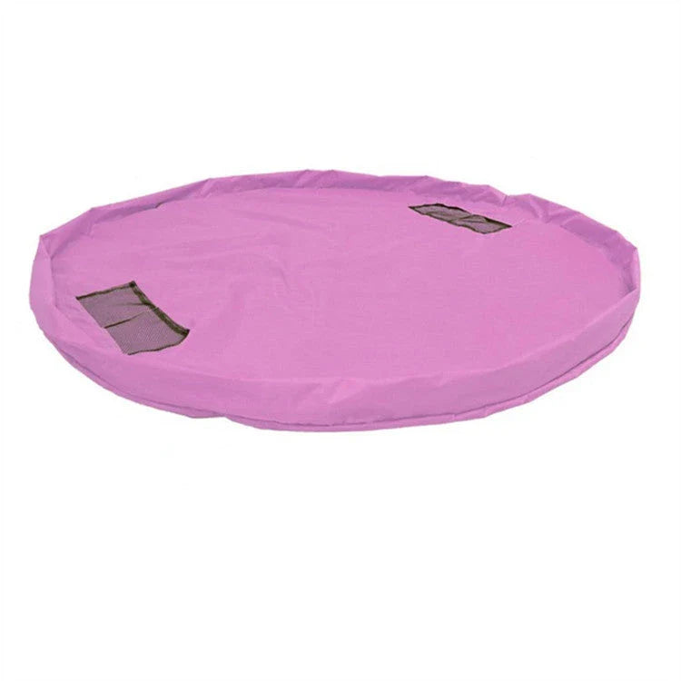 A large, waterproof travel picnic mat made of durable nylon with convenient toy storage bags for outdoor adventures.