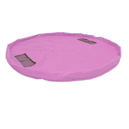 A large, waterproof travel picnic mat made of durable nylon with convenient toy storage bags for outdoor adventures.