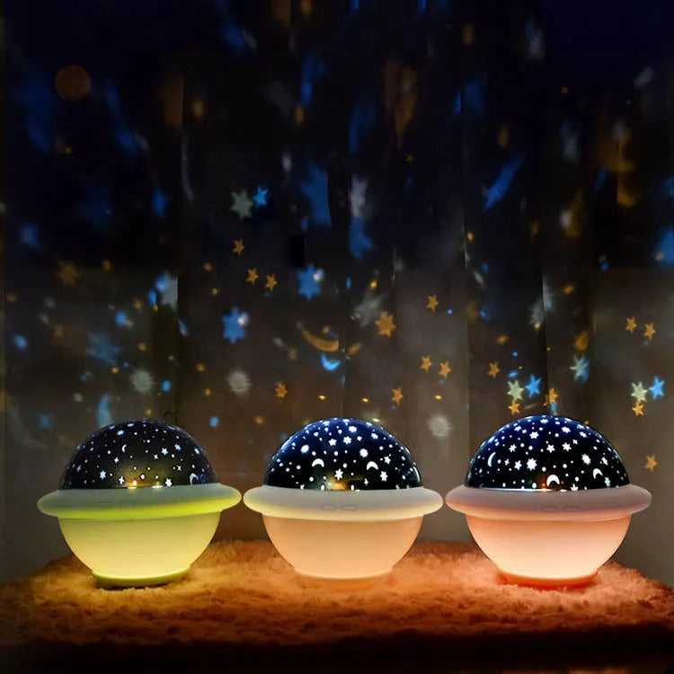 UFO-shaped starry sky light projection lamp in green, pink, or white, measuring 15.1 cm wide
