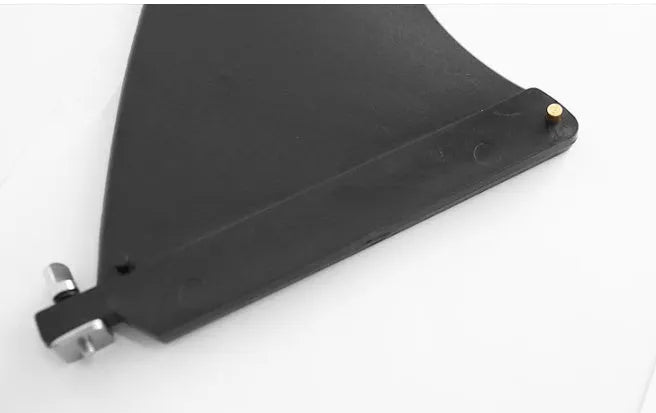 SUP paddle with detachable fish fins showing screw attachment system and plastic construction