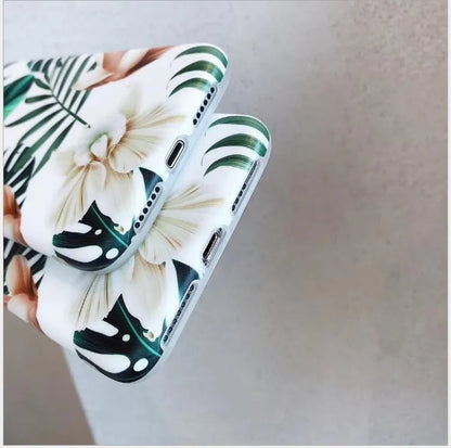 Retro floral iPhone case with banana leaf and flowers design in leaves colour on a soft TPU back cover.