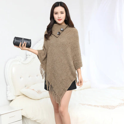 Sleeveless polka dot shawl in apricot colour draped over chair, showing 150cm length and acrylic fibre texture