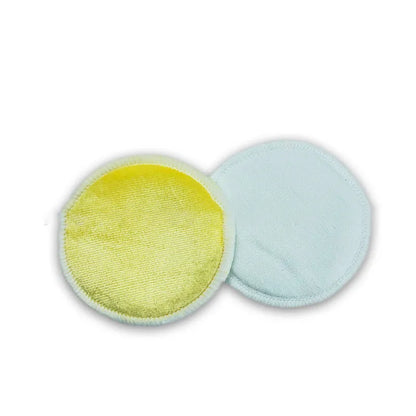 Set of water pink and light blue velvet makeup remover pads next to a cotton mesh storage bag.