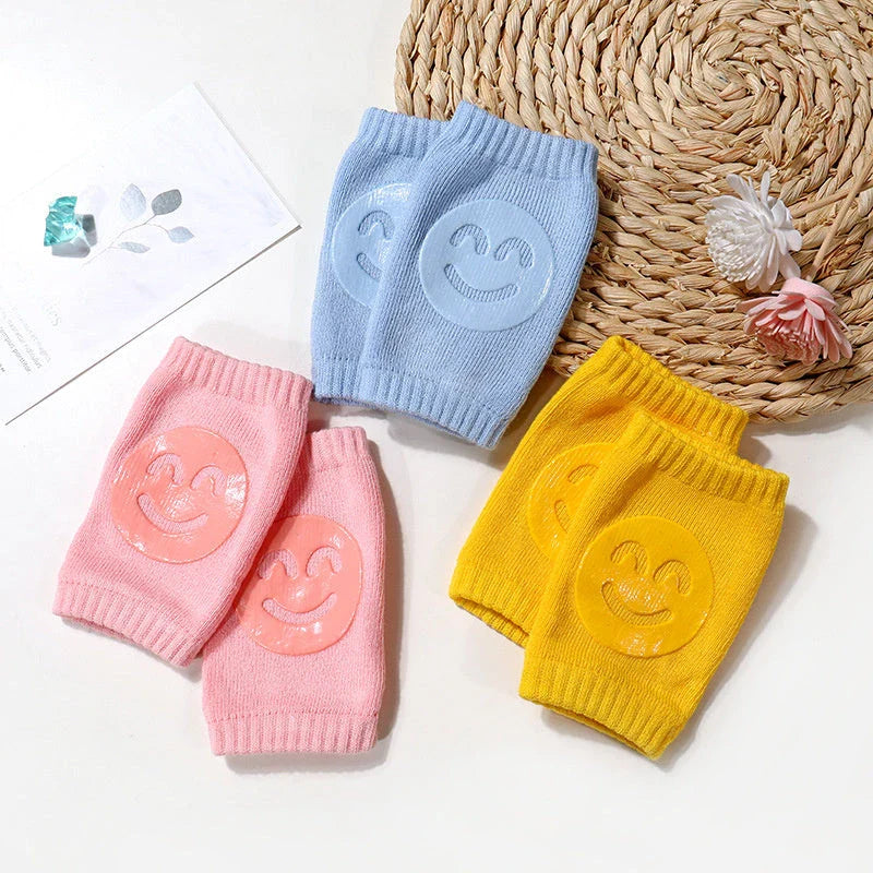 Cozy knee pads in various colors designed to protect babies during crawling with a non-slip, stretchy fit