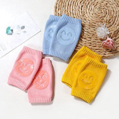 Cozy knee pads in various colors designed to protect babies during crawling with a non-slip, stretchy fit