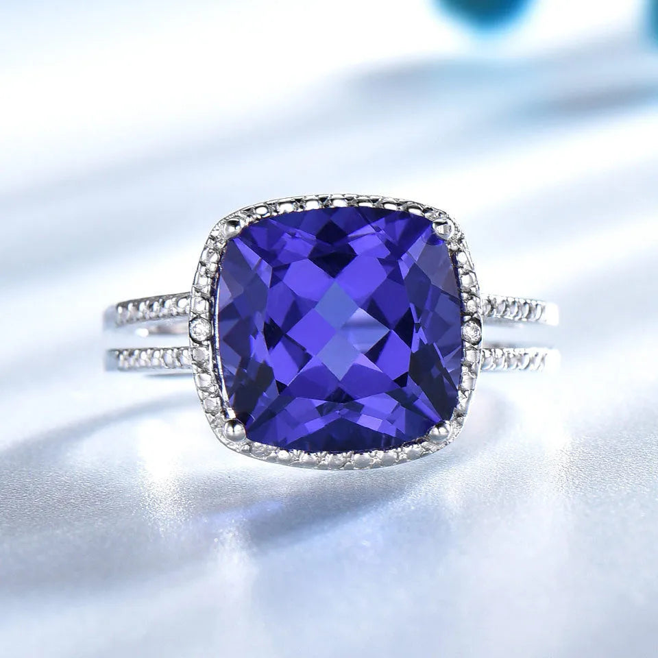 925 sterling silver ring with blue tanzanite gemstone, shown in UK sizes 6 to 10 for women's jewellery