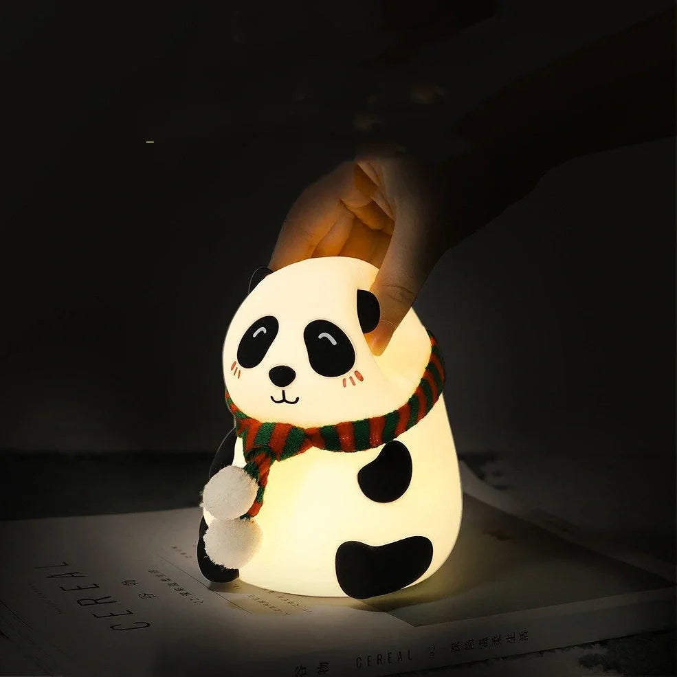 Panda-shaped silicone night light with soft white illumination, USB charging port visible
