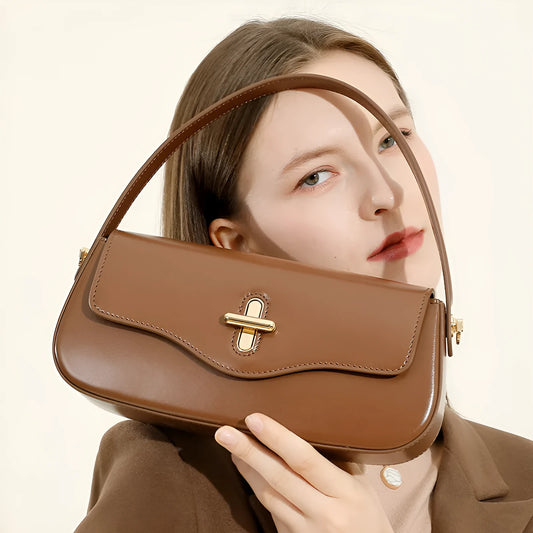 Genuine leather baguette handbag in clamshell design with internal organiser compartments