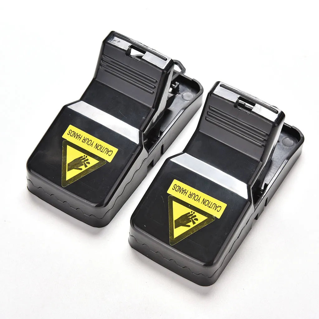 Six black plastic snapping mousetraps showing quick-kill mechanism and compact 11cm size
