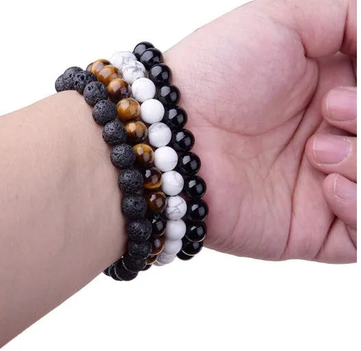 Geometric black agate bracelet for women with 8mm beads on a black elastic cord.