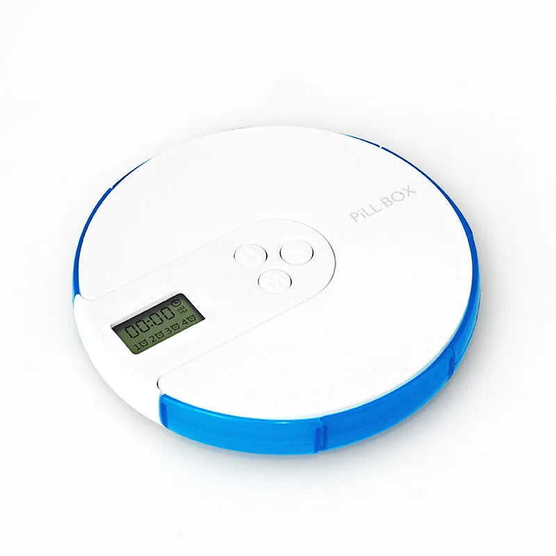 7-compartment alarm clock pill dispenser showing medication organisation with timer display