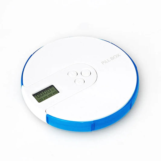 7-compartment alarm clock pill dispenser showing medication organisation with timer display