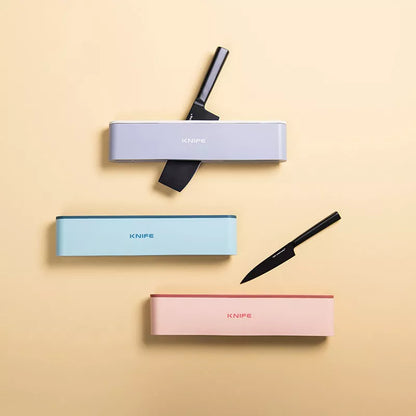 Wall-mounted kitchen knife holder in grey, pink, or light blue, semi-open design for better air circulation