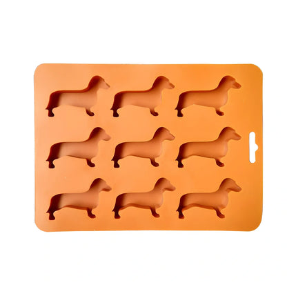 Orange silicone ice mould with 12 animal-shaped compartments for making decorative ice cubes