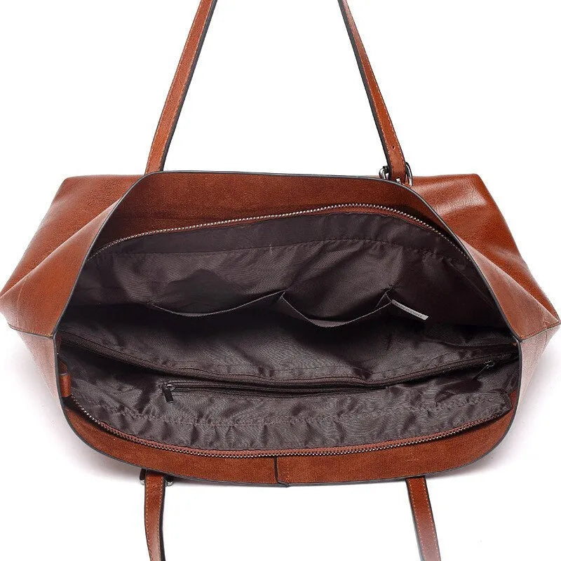 Leather cross-body handbag in Black colour with dimensions 30cm by 37cm by 13cm, showing internal pockets