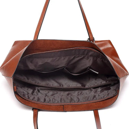 Leather cross-body handbag in Black colour with dimensions 30cm by 37cm by 13cm, showing internal pockets