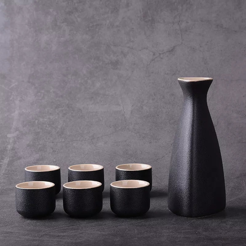 Sakura vintage sake set with ceramic kettle, wine glass, and triangle pot in traditional Japanese design