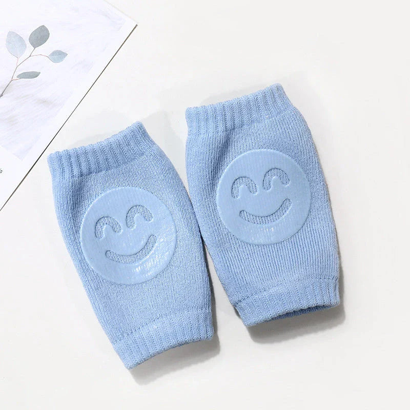 Cozy knee pads in various colors designed to protect babies during crawling with a non-slip, stretchy fit