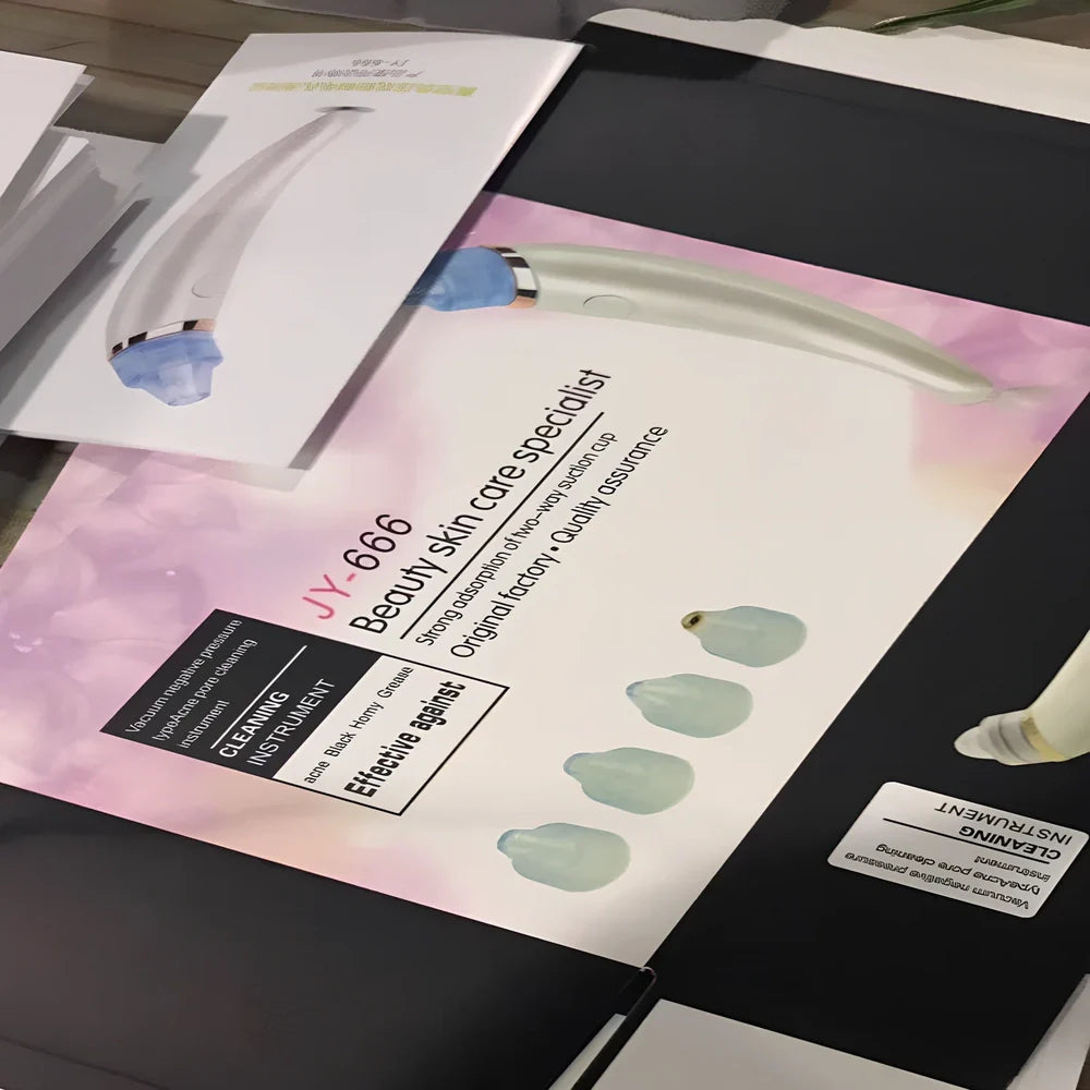 Electric blackhead suction instrument in rose gold and white colours for facial pore cleansing