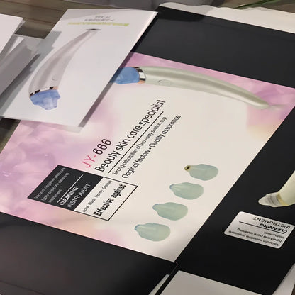 Electric blackhead suction instrument in rose gold and white colours for facial pore cleansing