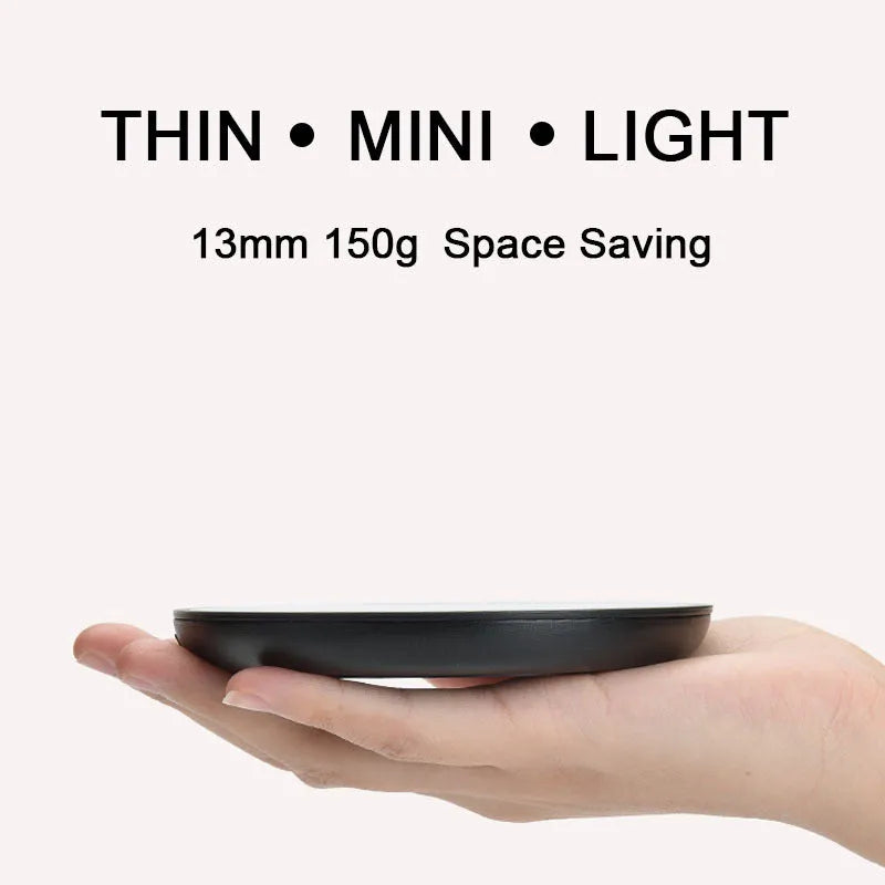 Black coffee mug warmer pad with temperature switch on desk
